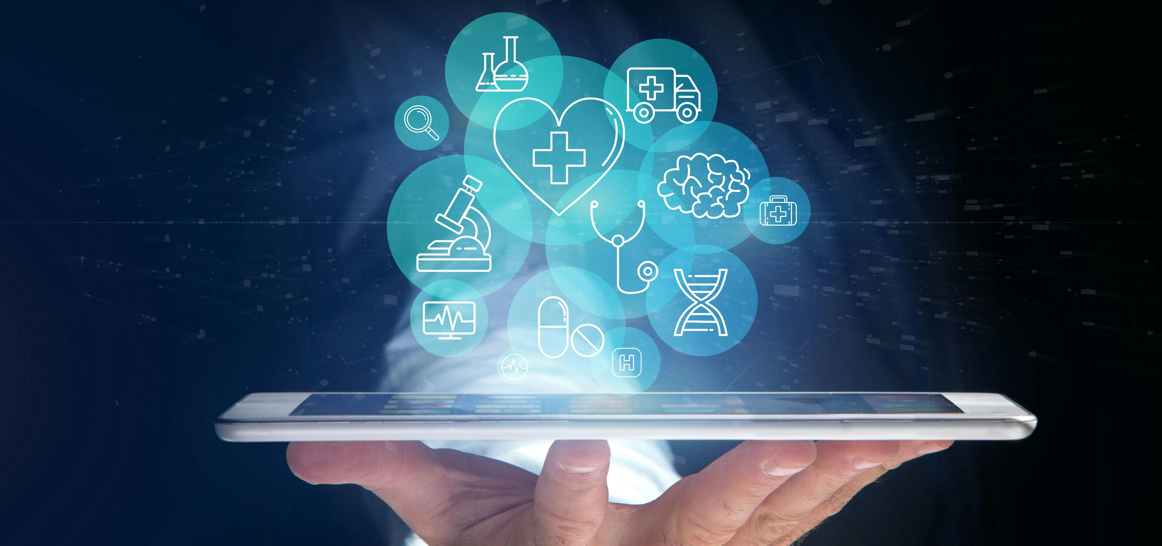 Person holding tablet with health care icons / Production Perig - stock.adobe.com