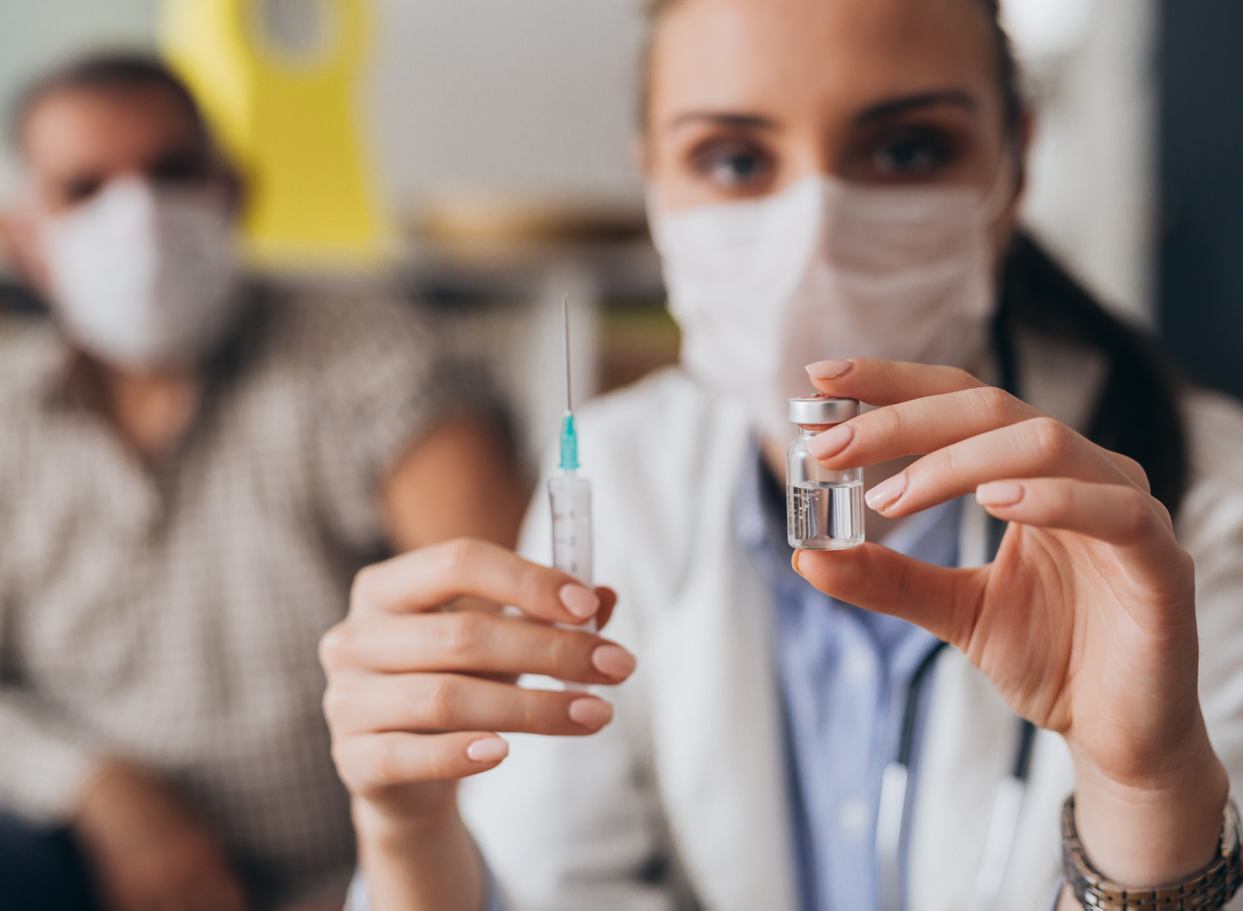 pharmacist administers vaccine