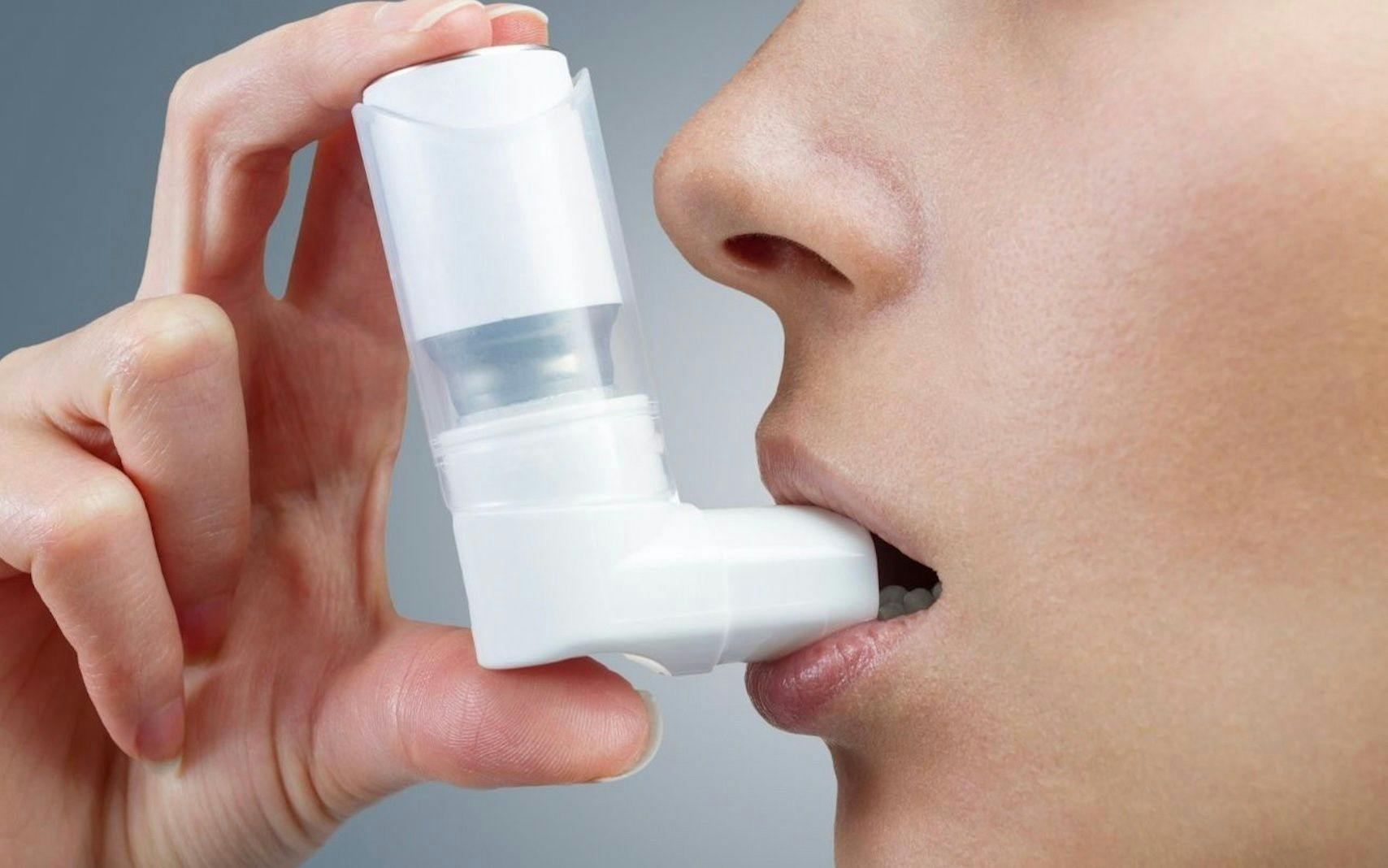 asthma patient using inhaler