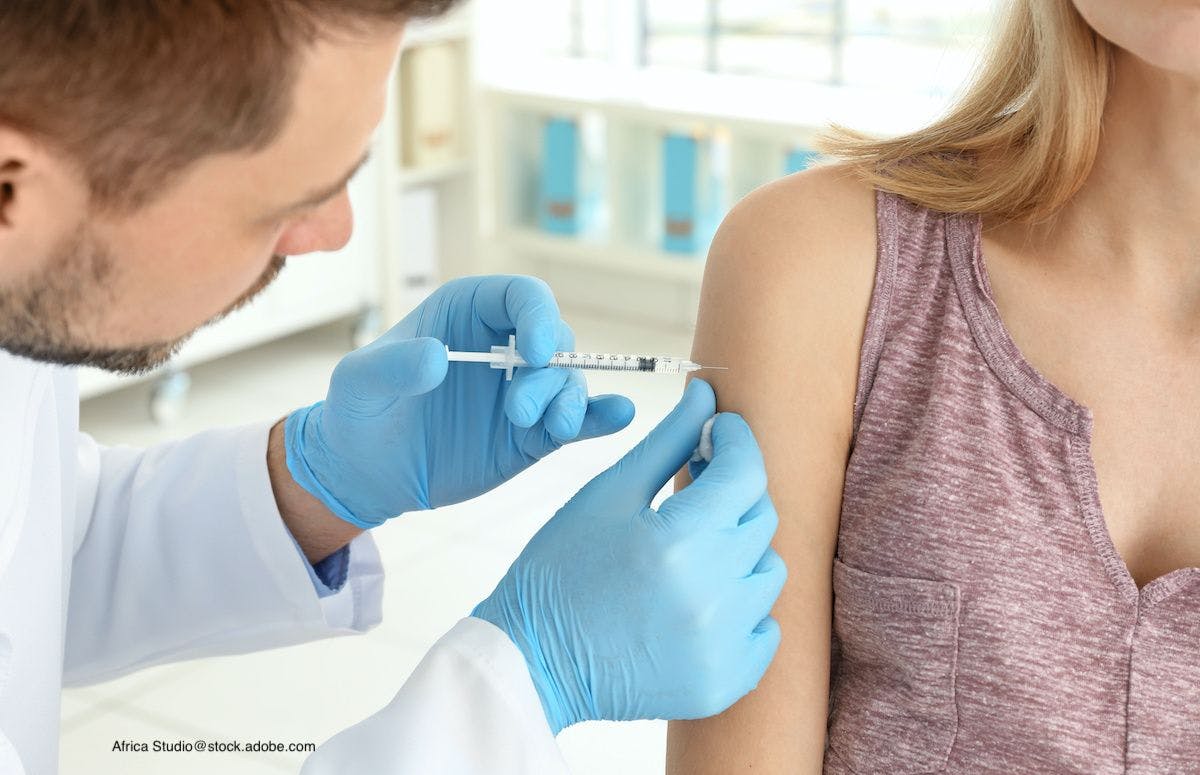 adult receiving vaccine from pharmacist