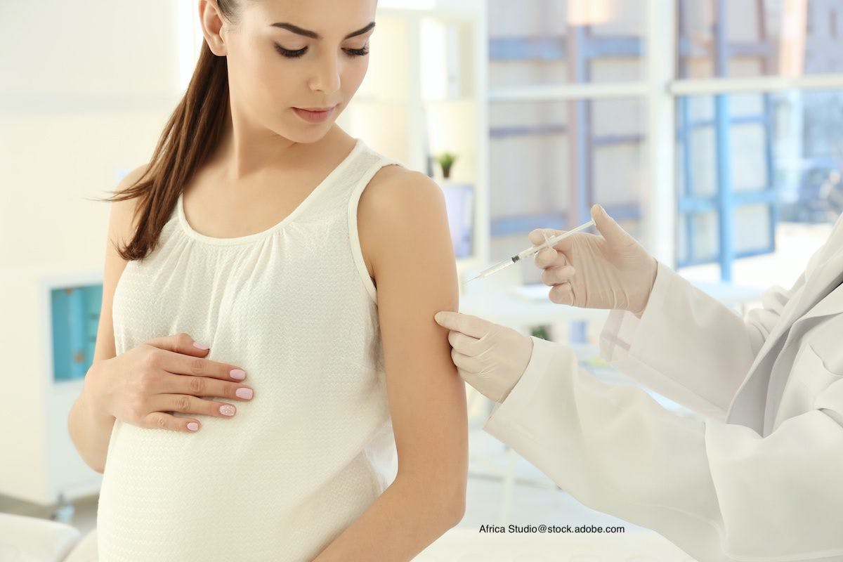 pregnant woman receiving a vaccine