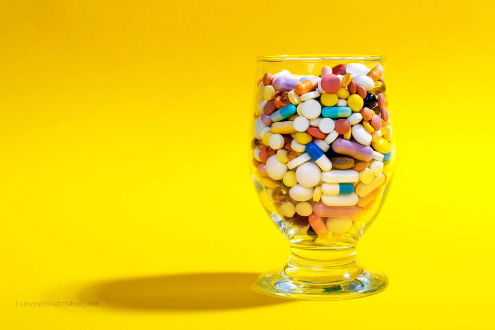 Pills in cocktail glass
