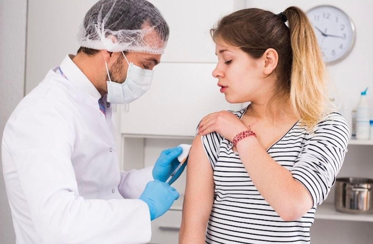 teenager receiving vaccine