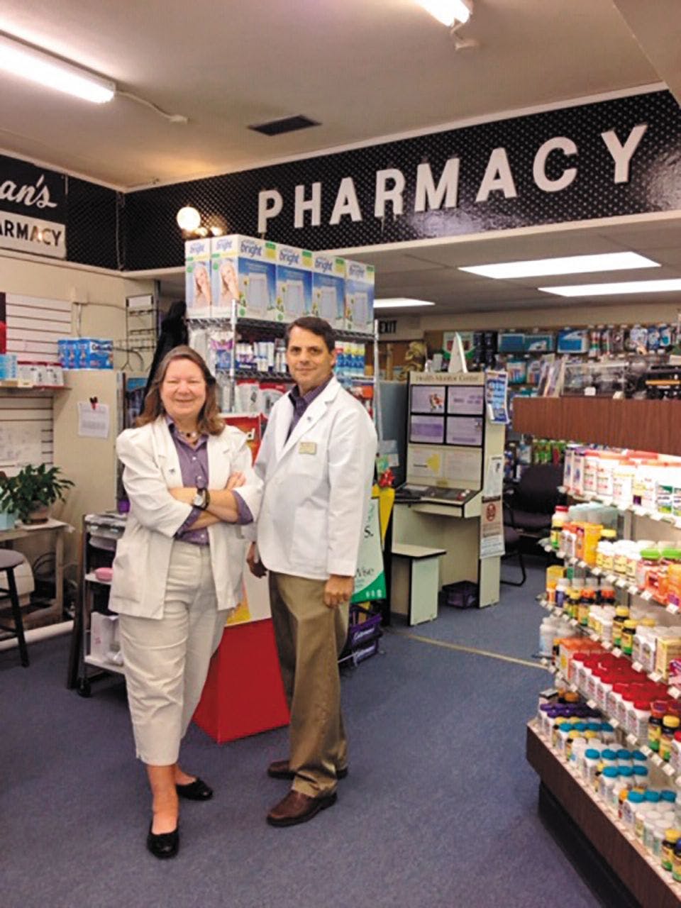 pharmacists in front of counter 